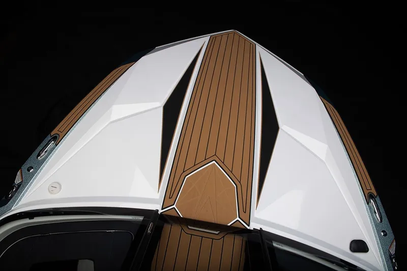 Slide: The Image of Manufacturer Provided Image: 2024 Nautique Ski boat deck with sleek design and wood accents. - 10