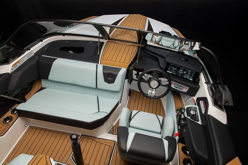 Slide: The Image of Manufacturer Provided Image: 2024 Nautique Ski boat interior with modern dashboard and seating. - 11