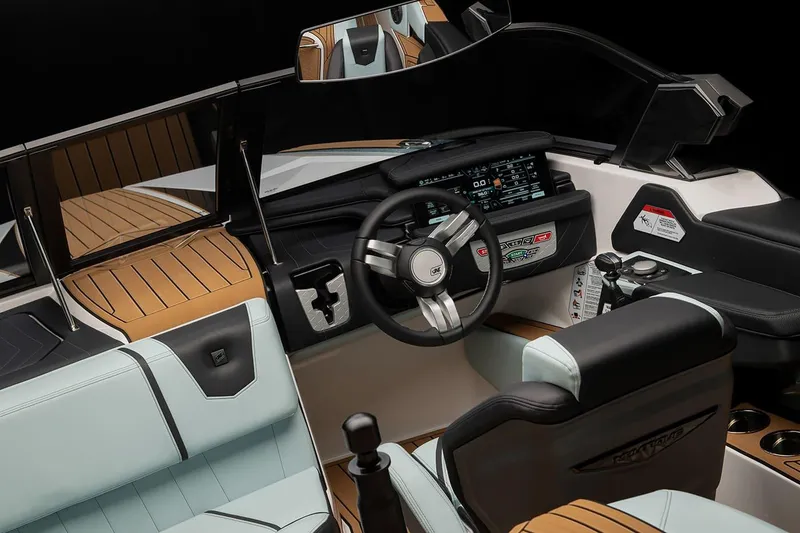 Slide: The Image of Manufacturer Provided Image: 2024 Nautique Ski boat interior with modern dashboard and luxurious seating. - 12