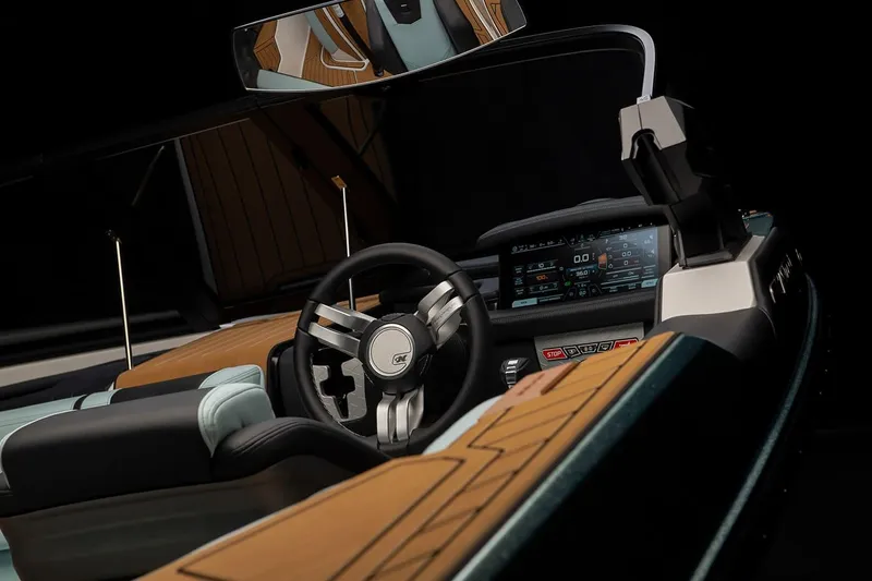 Slide: The Image of Manufacturer Provided Image: 2024 Nautique Ski boat interior with modern dashboard and steering wheel. - 13