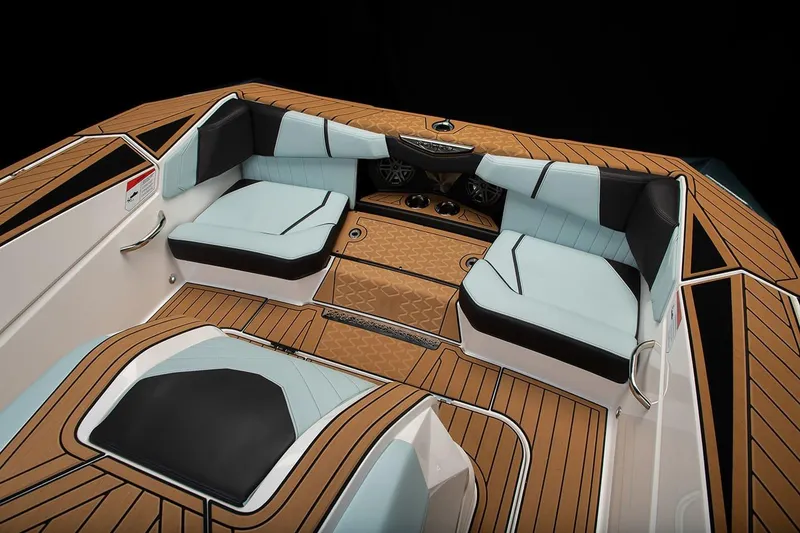 Slide: The Image of Manufacturer Provided Image: 2024 Nautique Ski boat interior with luxurious seating and teak flooring. - 16