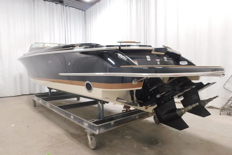 Slide: The Image of 2022 Chris-Craft Corsair 34 boat in a showroom, showcasing sleek design and craftsmanship. - 10