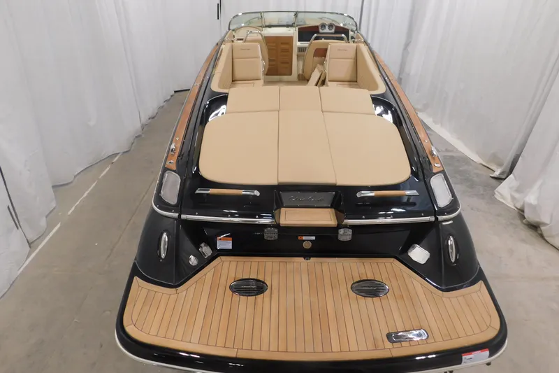 Slide: The Image of 2022 Chris-Craft Corsair 34 luxury boat with elegant teak deck and beige seating. - 14