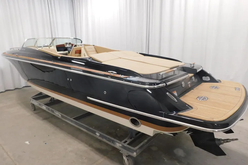 Slide: The Image of 2022 Chris-Craft Corsair 34 luxury boat with sleek black exterior and elegant design. - 15