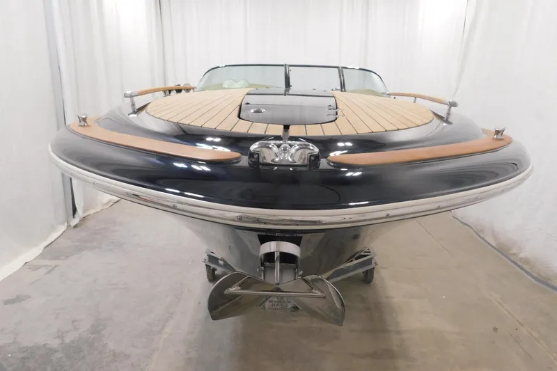 Slide: The Image of 2022 Chris-Craft Corsair 34 boat with sleek design and wooden deck. - 20