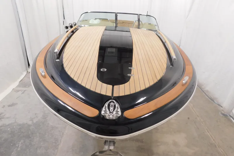 Slide: The Image of 2022 Chris-Craft Corsair 34 boat with sleek wooden deck and elegant design. - 21