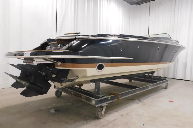 Slide: The Image of 2022 Chris-Craft Corsair 34 boat on display in a showroom setting. - 8