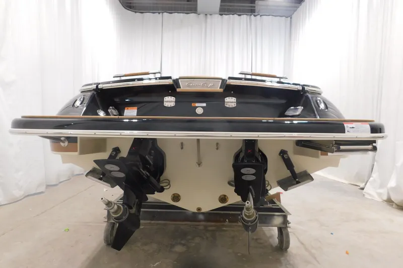 Slide: The Image of 2022 Chris-Craft Corsair 34 boat, rear view in a showroom setting. - 9