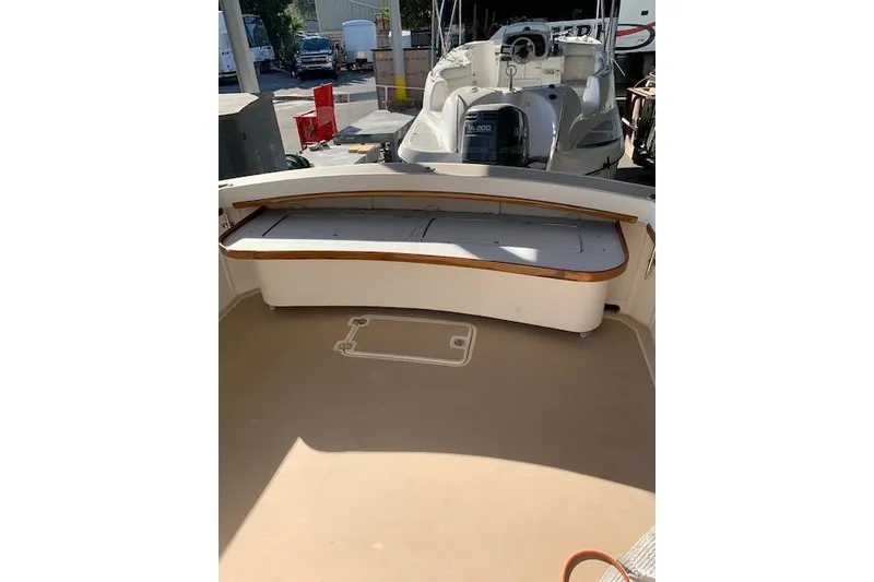 Slide: The Image of 1999 Nauset Downeast Cruiser boat interior with seating and storage area. - 11
