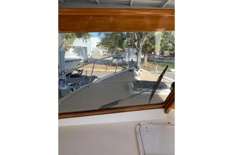 Slide: The Image of 1999 Nauset Downeast Cruiser boat interior view through windshield. - 13