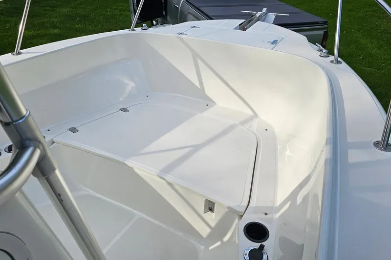 Slide: The Image of 1999 Boston Whaler 23 Outrage boat interior, featuring spacious seating and sleek design. - 12