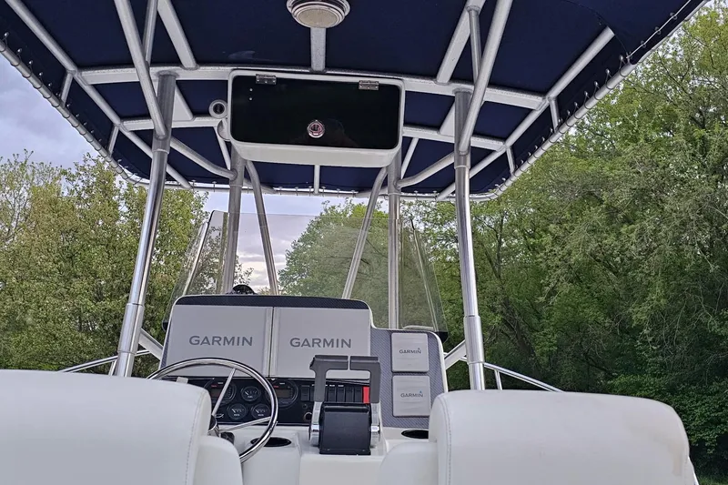 Slide: The Image of Interior view of a 1999 Boston Whaler 23 Outrage boat with Garmin navigation equipment. - 5