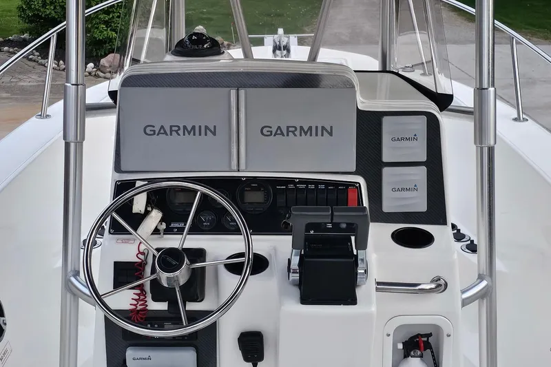 Slide: The Image of 1999 Boston Whaler 23 Outrage boat dashboard with Garmin navigation equipment. - 8