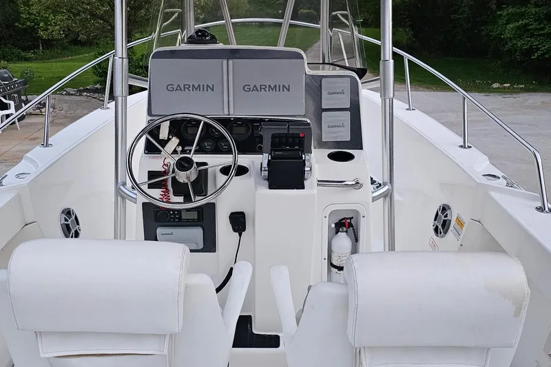 Slide: The Image of 1999 Boston Whaler 23 Outrage boat cockpit with Garmin navigation system. - 9