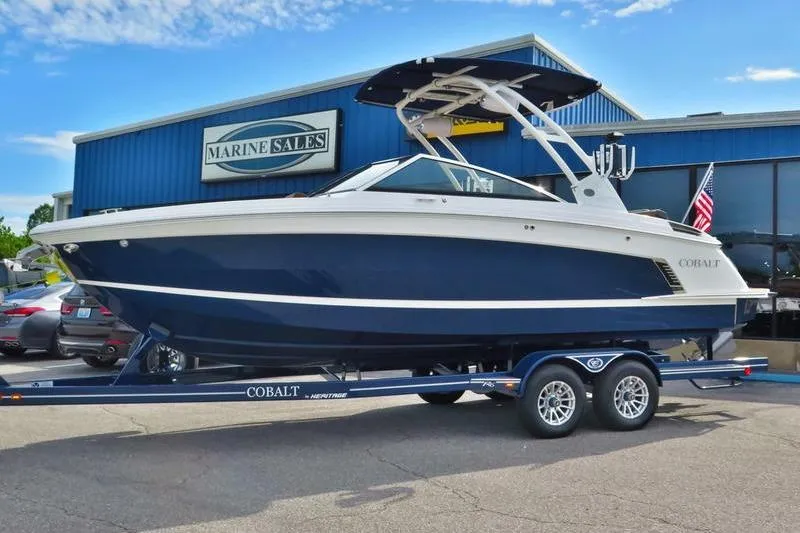 Slide: The Image of 2023 Cobalt R6 Surf boat on trailer at Marine Sales dealership. - 11
