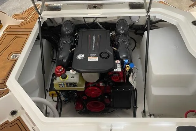 Slide: The Image of 2023 Cobalt R6 Surf boat engine compartment, showcasing a powerful inboard motor. - 13