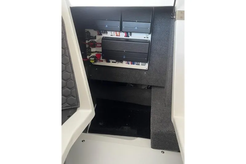 Slide: The Image of 2023 Cobalt R6 Surf boat interior showing electrical panel and wiring setup. - 16