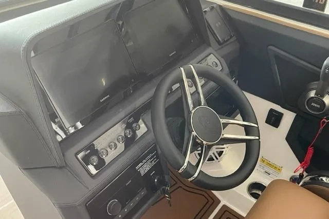 Slide: The Image of Steering console of 2023 Cobalt R6 Surf boat with modern controls and displays. - 8
