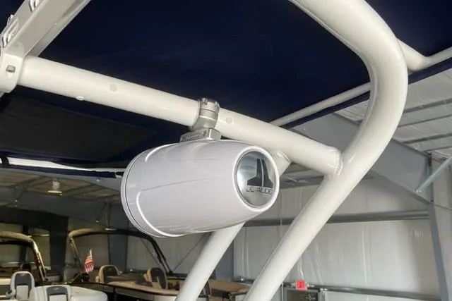Slide: The Image of Speaker mounted on 2023 Cobalt R6 Surf boat's frame in a showroom. - 9