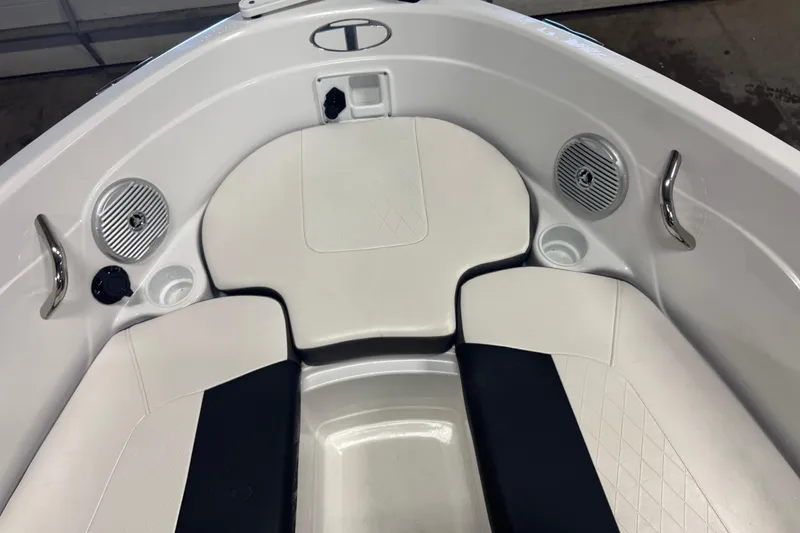 Slide: The Image of Interior of 2023 Tahoe 200 S boat with white seating and speakers. - 14