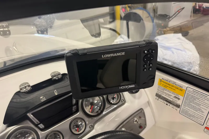 Slide: The Image of Dashboard of a 2023 Tahoe 200 S boat with Lowrance Hook Reveal device. - 7