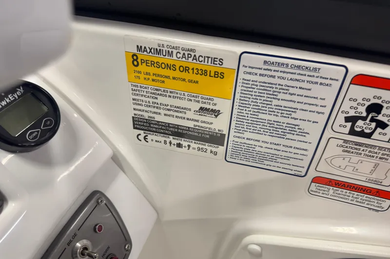 Slide: The Image of 2023 Tahoe 200 S boat capacity label, safety checklist, and control panel details. - 8
