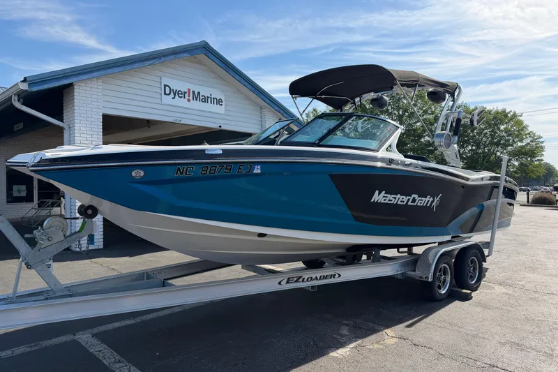 The Image of 2018 MasterCraft X26 boat on trailer at Dyer Marine dealership. - 1