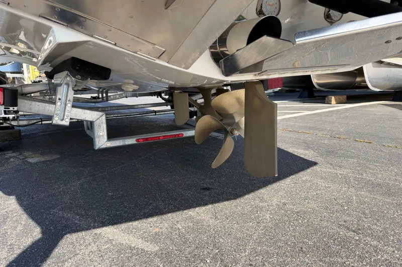 Slide: The Image of 2018 MasterCraft X26 boat propeller and rudder on a trailer. - 16