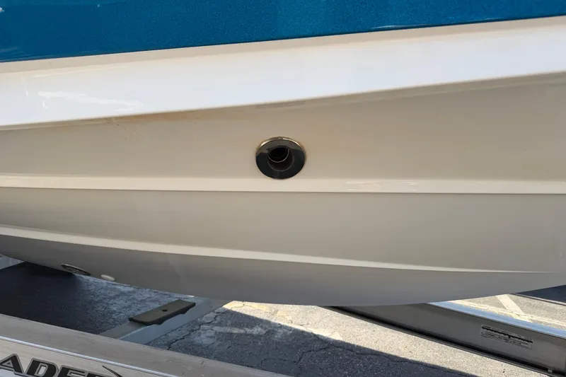 Slide: The Image of 2018 MasterCraft X26 boat hull detail on trailer, showcasing sleek design and craftsmanship. - 6