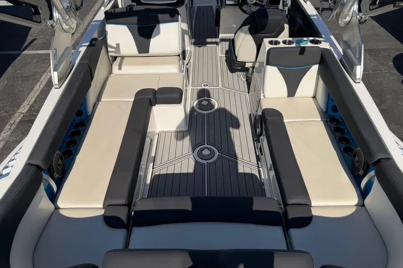 Slide: The Image of 2018 MasterCraft X26 boat interior with sleek seating and modern design. - 8