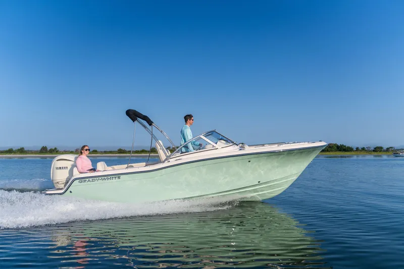 The Image of 2025 Grady-White Freedom 215 boat on water, featuring Yamaha outboard motor. - 0