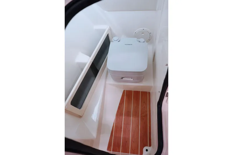 Slide: The Image of 2025 Grady-White Freedom 215 boat on water, featuring Yamaha outboard motor. - 12