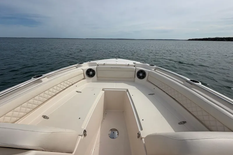 Slide: The Image of 2025 Grady-White Freedom 215 boat interior with spacious seating on open water. - 24