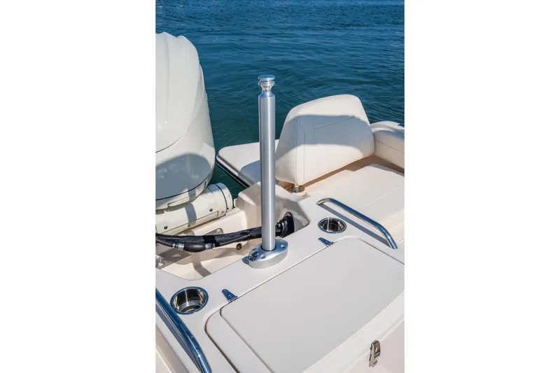 Slide: The Image of 2025 Grady-White Freedom 215 boat on calm water, featuring Yamaha outboard motor. - 3