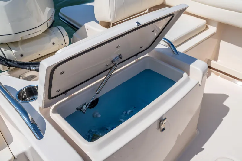 Slide: The Image of 2025 Grady-White Freedom 215 boat on water, featuring Yamaha engine. - 5