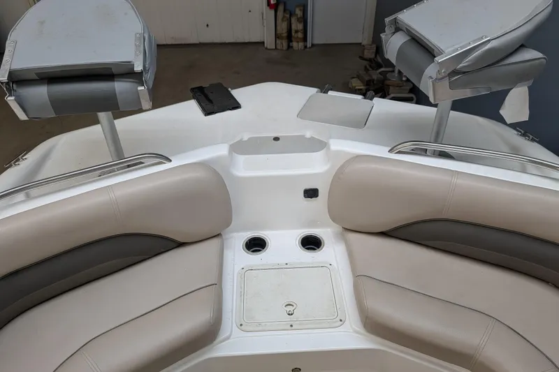 Slide: The Image of Interior of a 2013 Hurricane SunDeck Sport 201 IO boat with seating and cup holders. - 10
