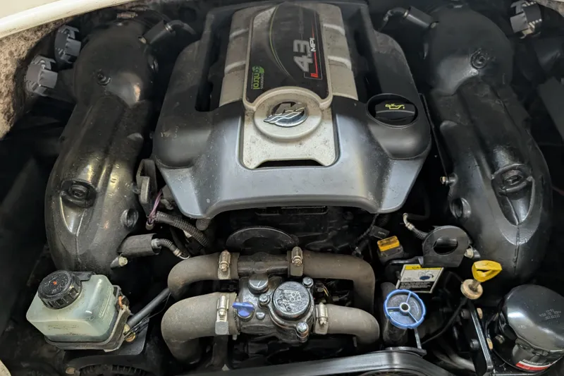 Slide: The Image of Engine of 2013 Hurricane SunDeck Sport 201 IO boat, showcasing components and layout. - 11