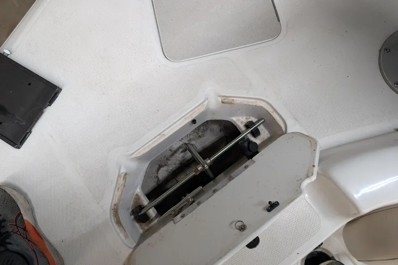 Slide: The Image of 2013 Hurricane SunDeck Sport 201 IO boat interior with open storage compartment. - 13