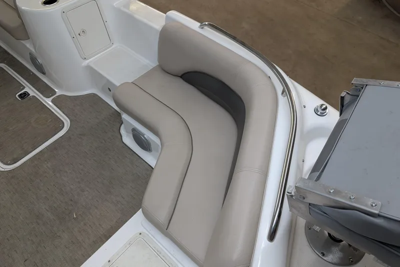 Slide: The Image of 2013 Hurricane SunDeck Sport 201 IO boat interior with beige seating and carpeted floor. - 4