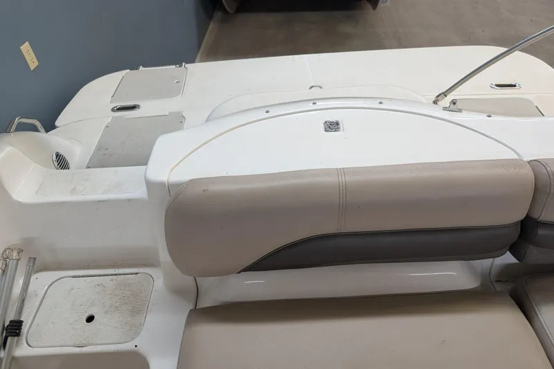 Slide: The Image of 2013 Hurricane SunDeck Sport 201 IO boat interior with beige seating and white deck. - 7