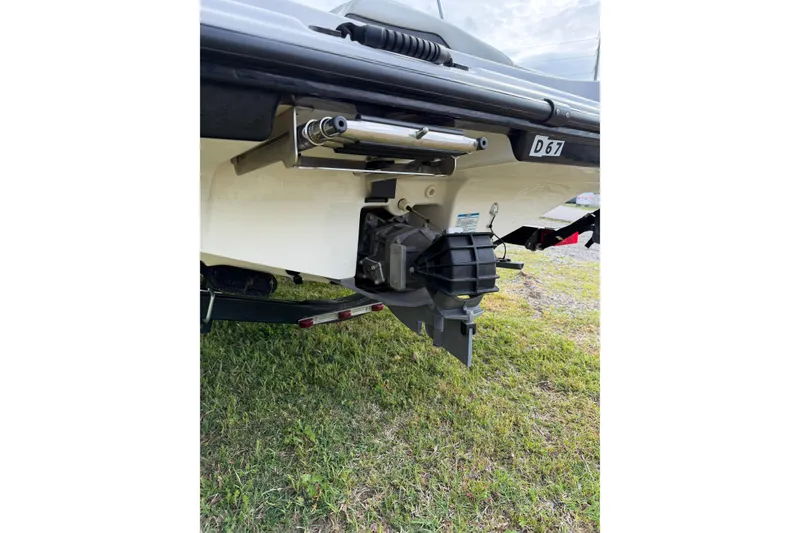 Slide: The Image of 2016 Yamaha Boats SX190 rear view showing jet drive system on grass. - 3