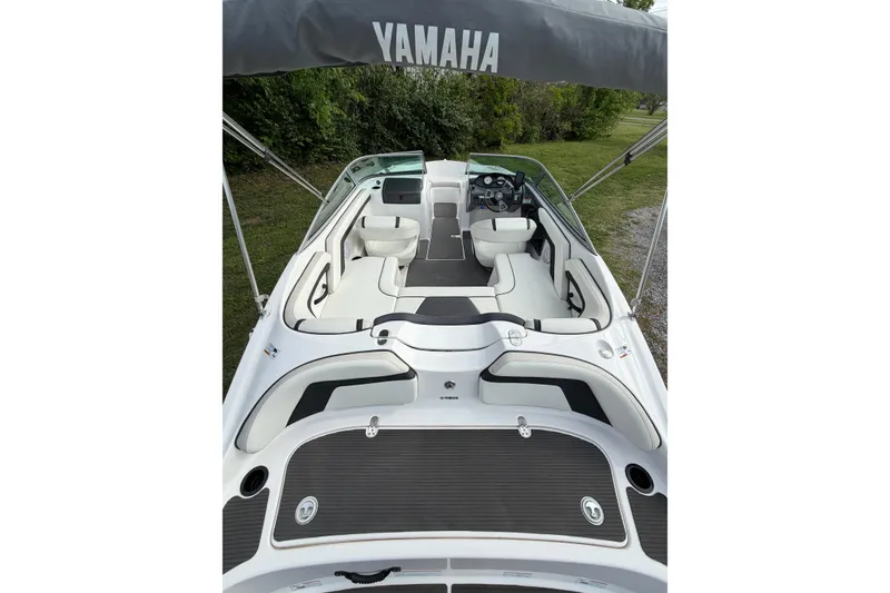 Slide: The Image of 2016 Yamaha SX190 boat interior with seating and steering wheel, featuring sleek design. - 5