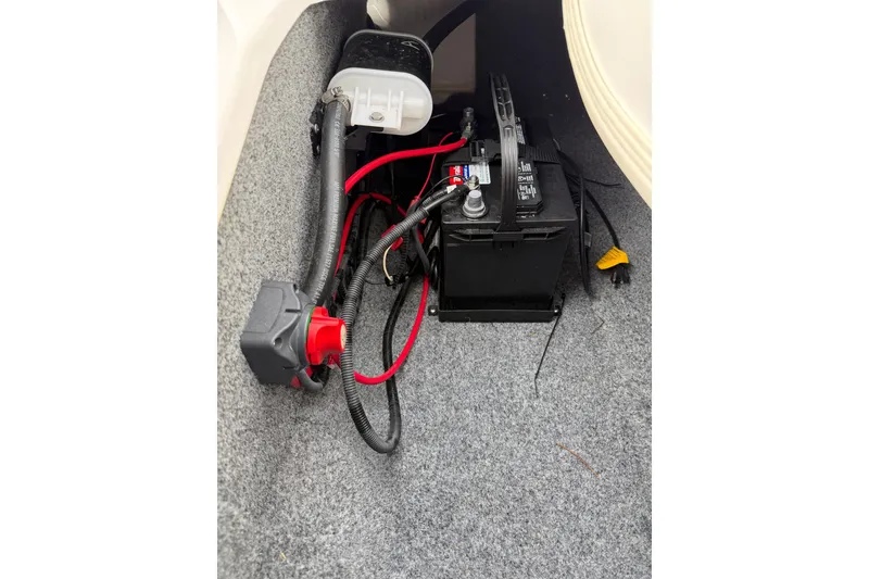 Slide: The Image of 2016 Yamaha SX190 boat battery compartment with wiring and components. - 8
