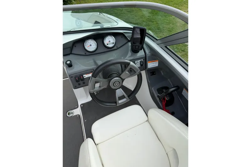 Slide: The Image of 2016 Yamaha Boats SX190 dashboard with steering wheel and gauges. - 9