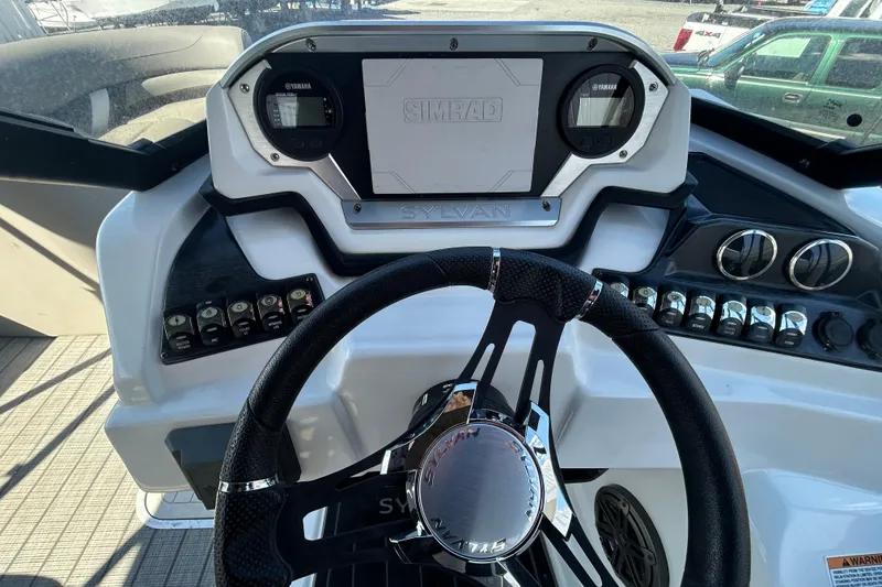 Slide: The Image of Cockpit view of 2023 Sylva S3 boat with steering wheel and control panel. - 11