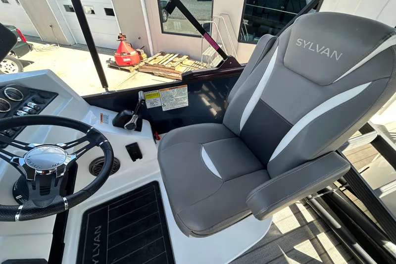 Slide: The Image of Captain's seat and steering wheel of 2023 Sylva S3 boat, featuring modern controls and design. - 12