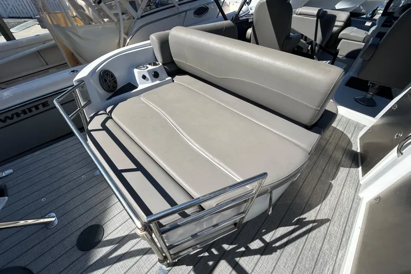 Slide: The Image of 2023 Sylva S3 boat interior with gray cushioned seating and stainless steel railing. - 6