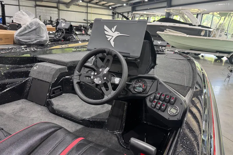Slide: The Image of Interior of a 2026 Skeeter ZXE20 boat showcasing steering and control panel. - 10