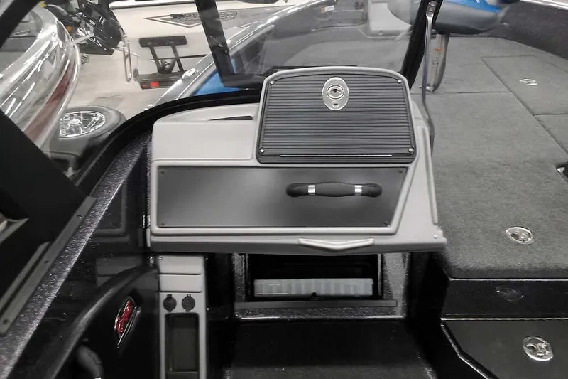 Slide: The Image of 2026 Ranger 1880MS A Pack Equipped boat interior with storage compartments and control panel. - 15