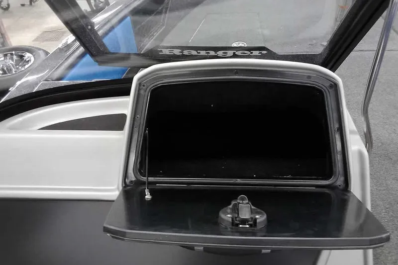 Slide: The Image of Open storage compartment in 2026 Ranger 1880MS A Pack Equipped boat. - 16